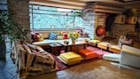 A beautifully designed living room featuring natural wood and stone elements.