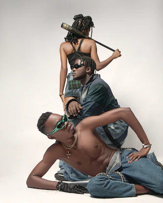 a man sitting on the ground next to a woman