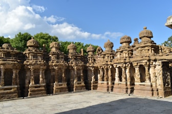 a group of stone statues sitting next to each other