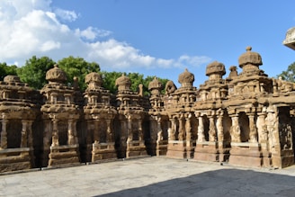 a group of stone statues sitting next to each other