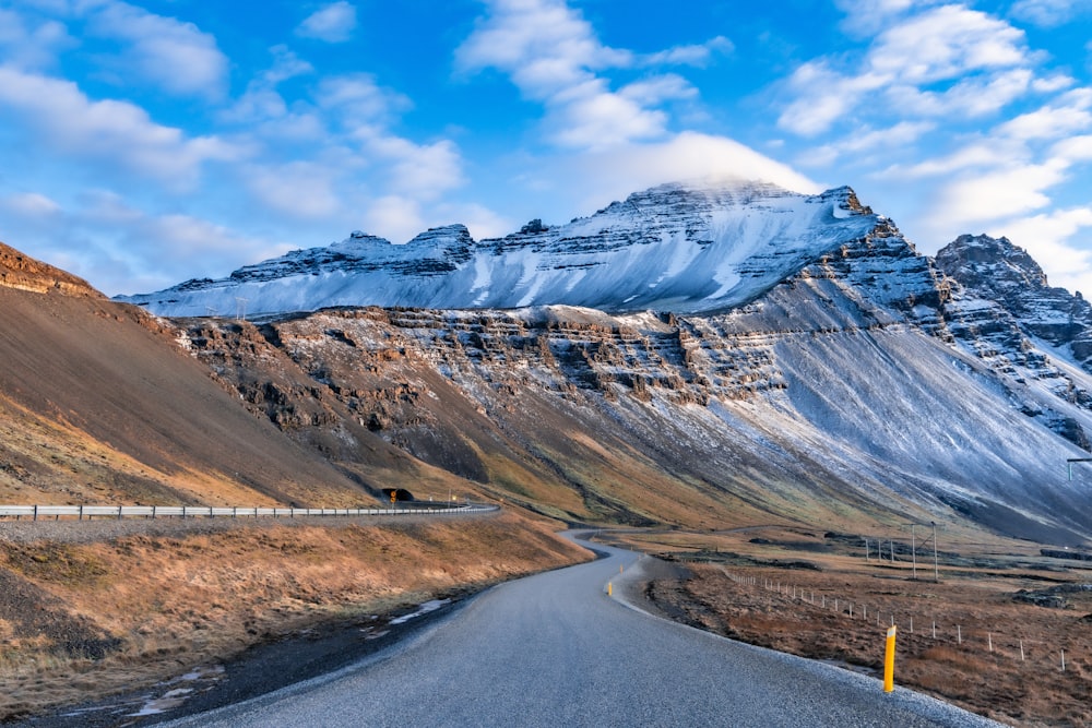 a road with a mountain in the background