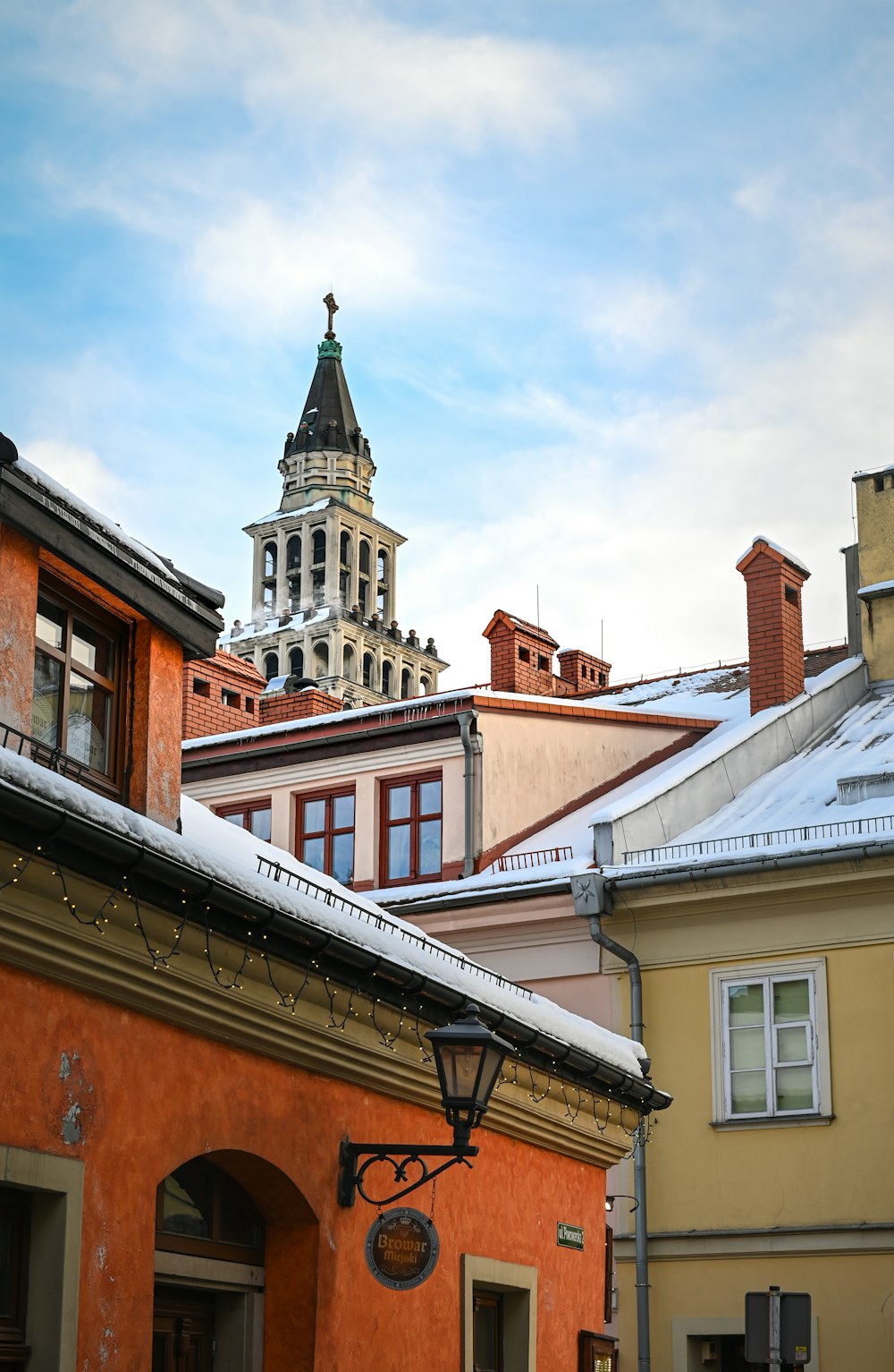 a building with a clock tower in the background