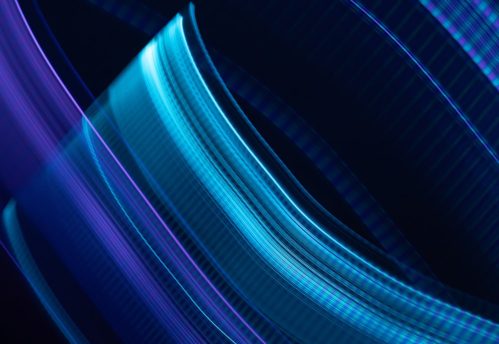 a blue and purple abstract background with lines