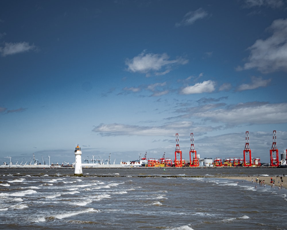 a lighthouse on the shore of a large body of water