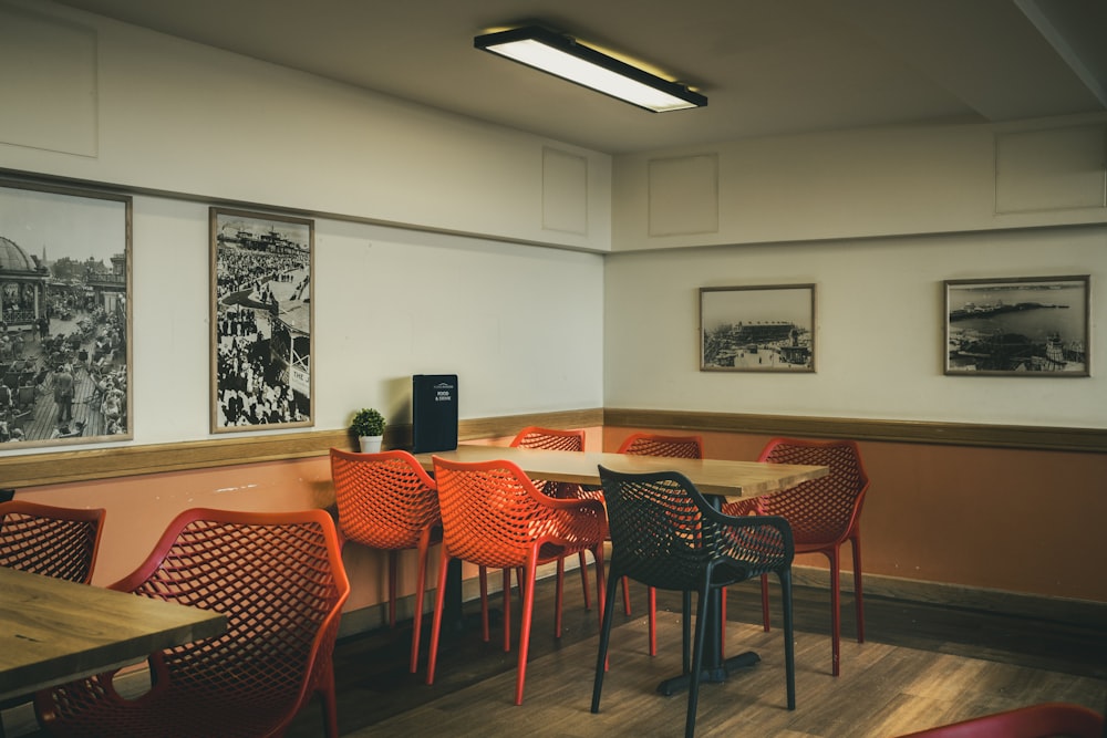 a dining room with a long table and chairs