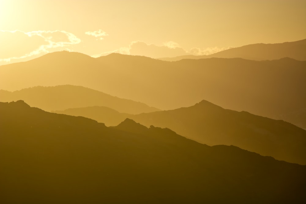 a view of a mountain range at sunset