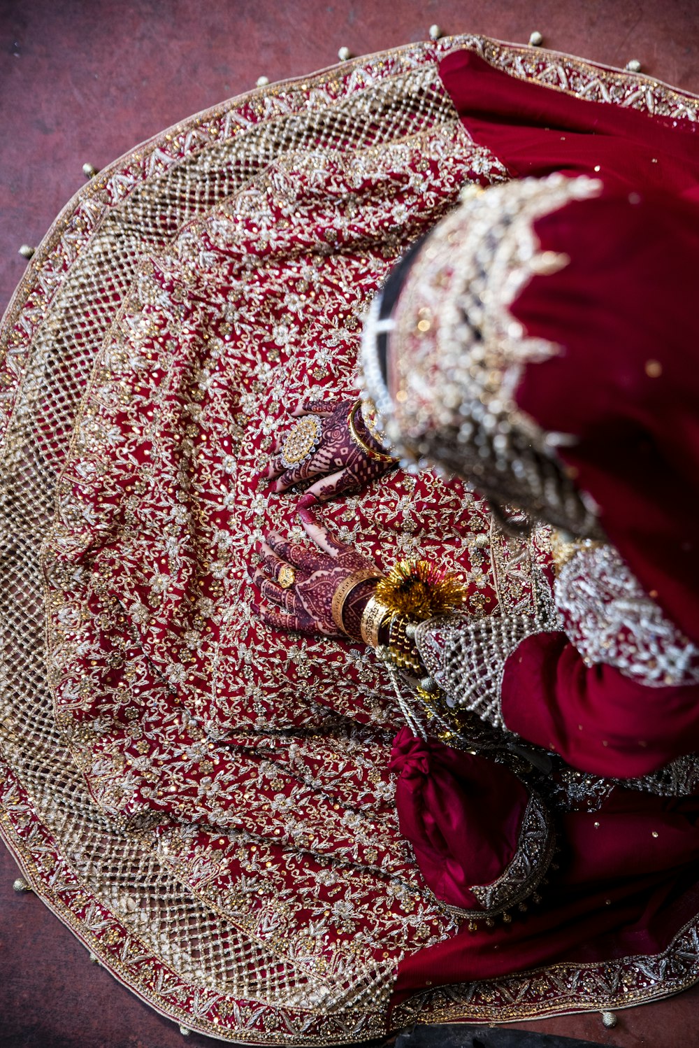 a woman in a red and gold dress