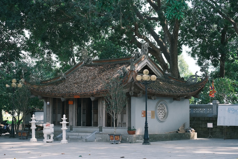 a small building with a tree in front of it