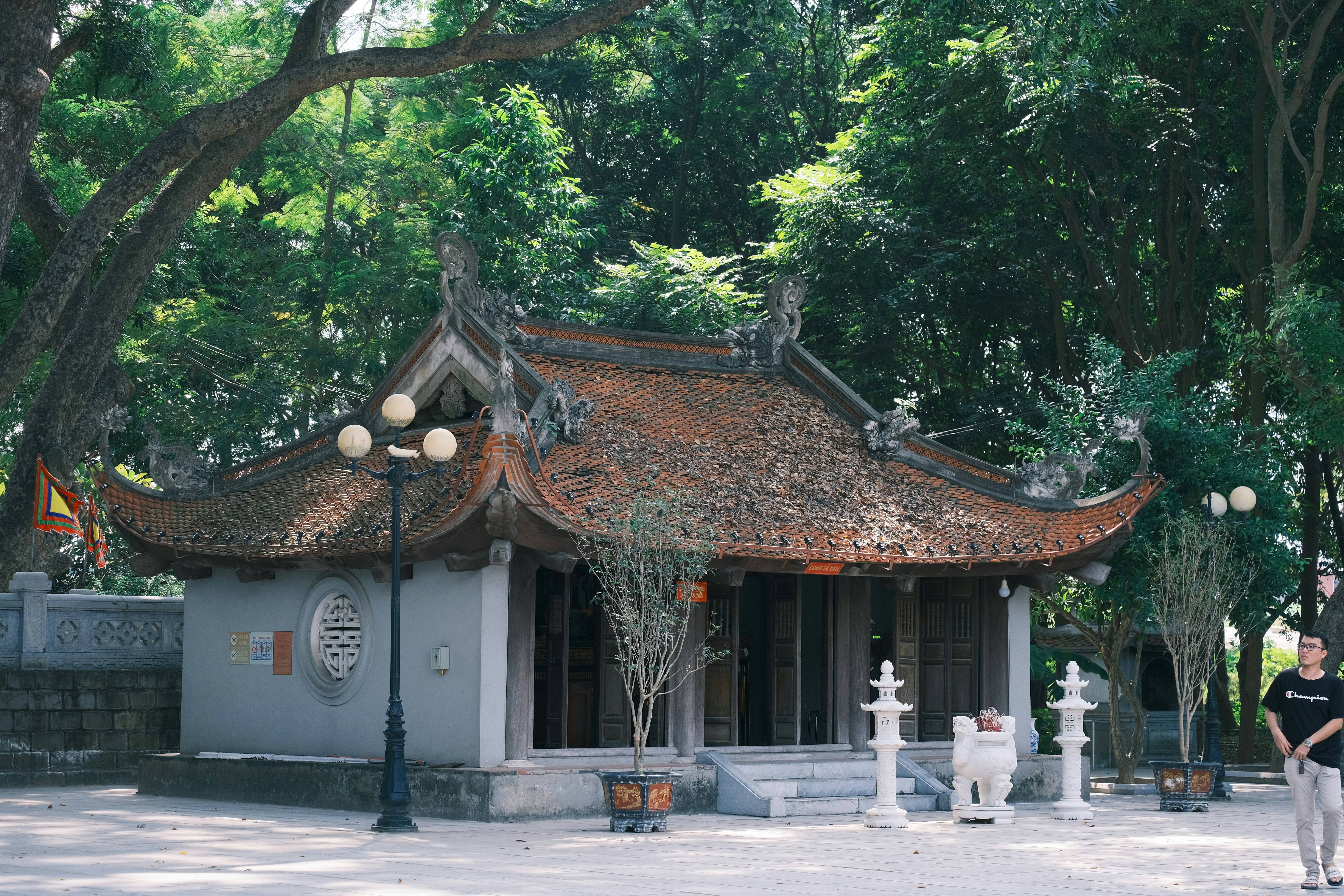 a man standing in front of a small building