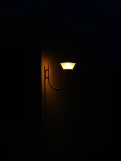 Elegant solar wall lights casting soft light on a cozy patio.