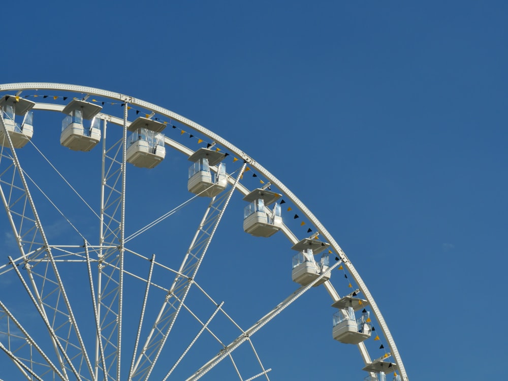 a ferris wheel against a clear blue sky