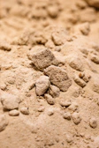 Close-up of fine sand texture in a construction site setting.