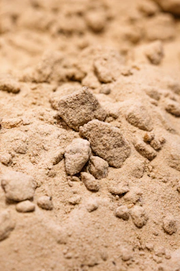 Close-up of fine sand texture in a construction site setting.