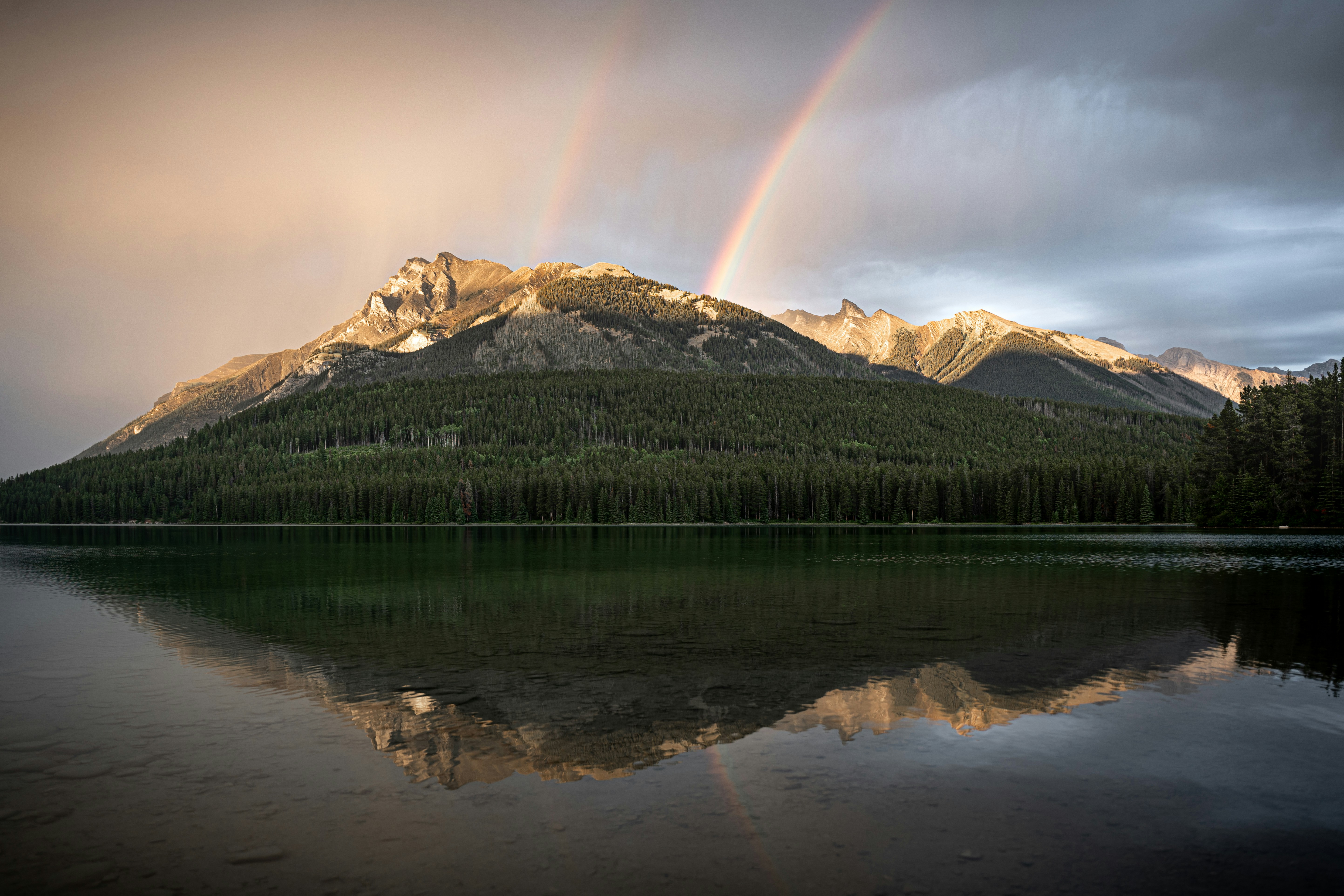 a mountain with a rainbow in the sky