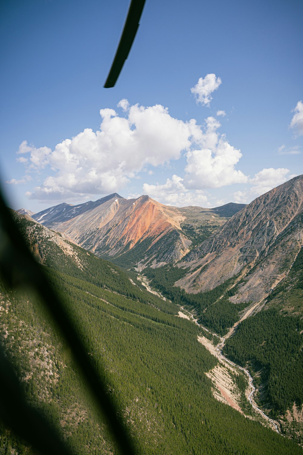 a view of a valley and mountains from a plane