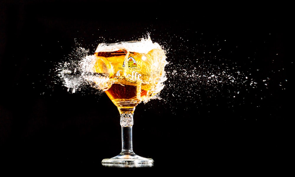 a glass filled with liquid on top of a table