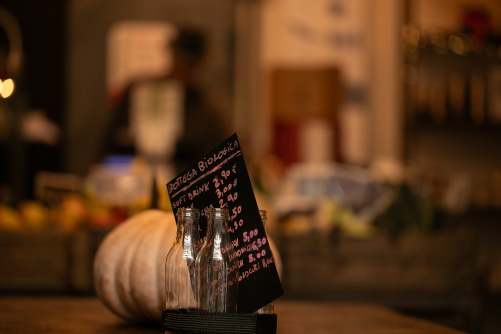 a couple of bottles sitting on top of a wooden table