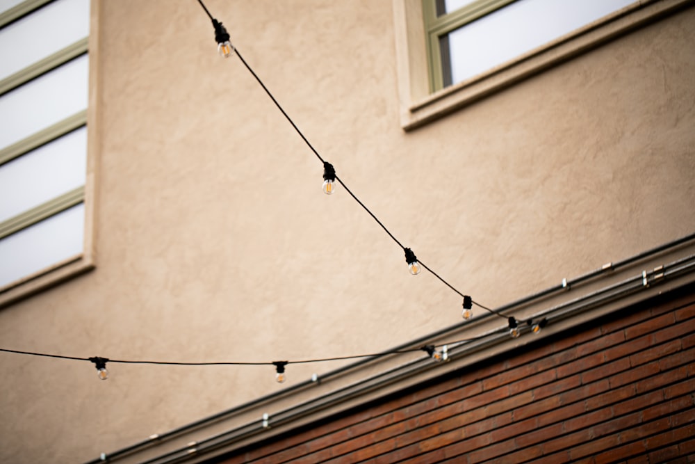 a building with a string of lights hanging from it's side