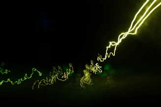 Vibrant neon green and orange light particles forming a dynamic DNA helix twisting gracefully on the right side of the frame.