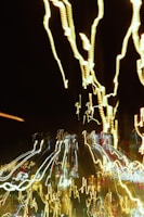 Abstract light trails weaving through the dark room, suggesting vibrational energy and the sensory space of the body.