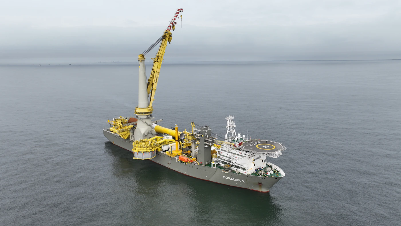 Large ship alone in the middle of the open ocean, representing a seaman's right to maintenance and cure