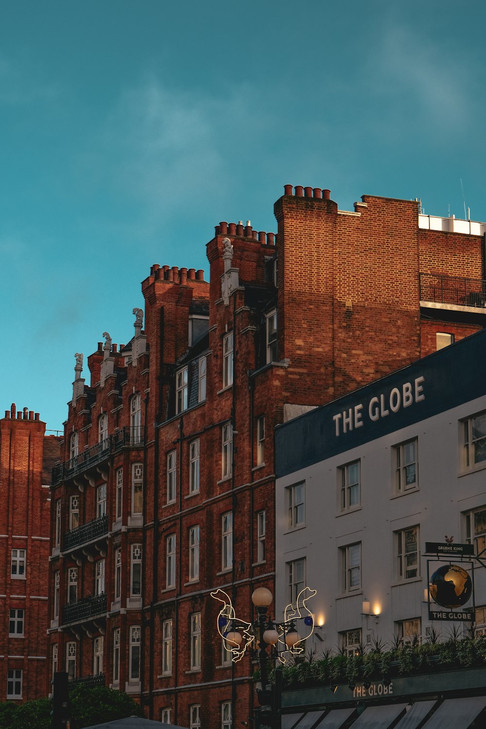 a building with a sign that says the globe on it