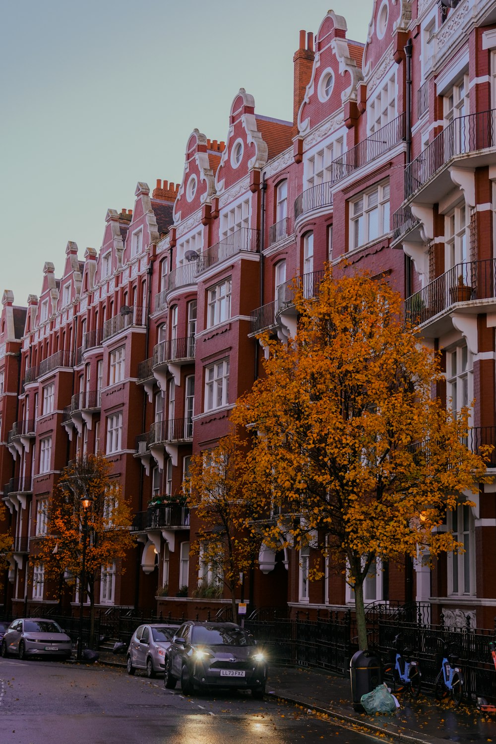 a row of red brick buildings on a city street