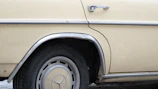 Close-up of a custom rubber profile fitted perfectly on a vintage car door frame