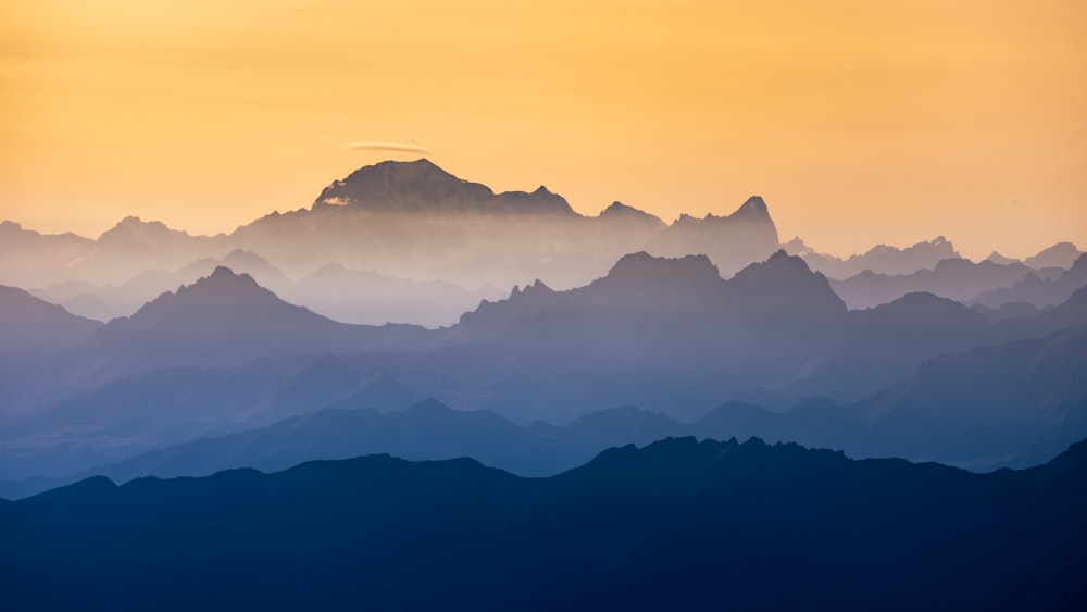 a view of a mountain range at sunset