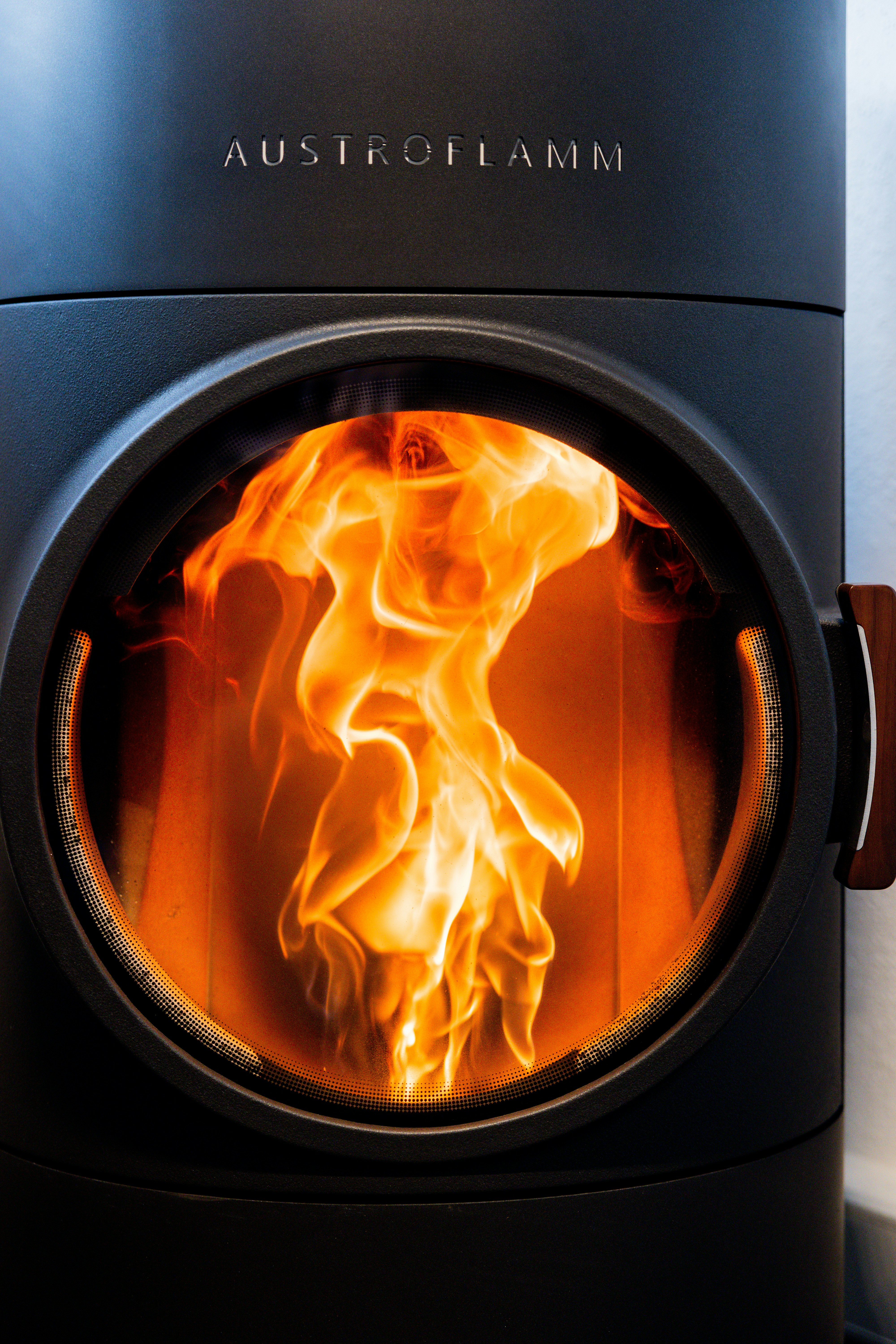 A fire burning inside of a black stove photo Free Indoors Image on