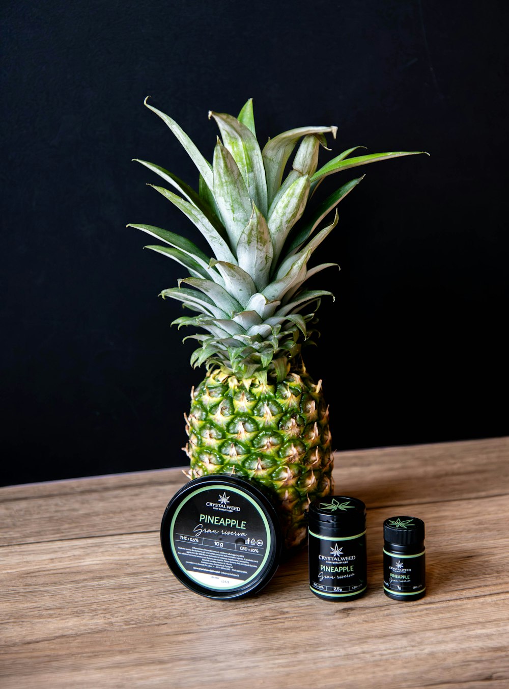 a pineapple sitting on top of a wooden table