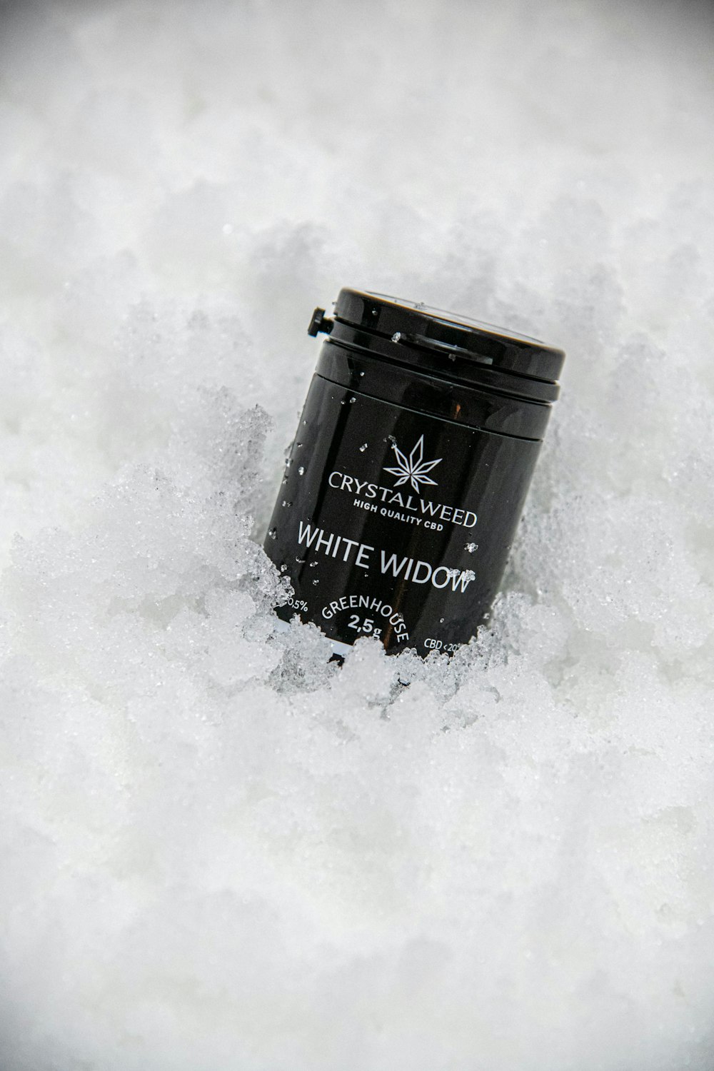 a can of white widow in the snow