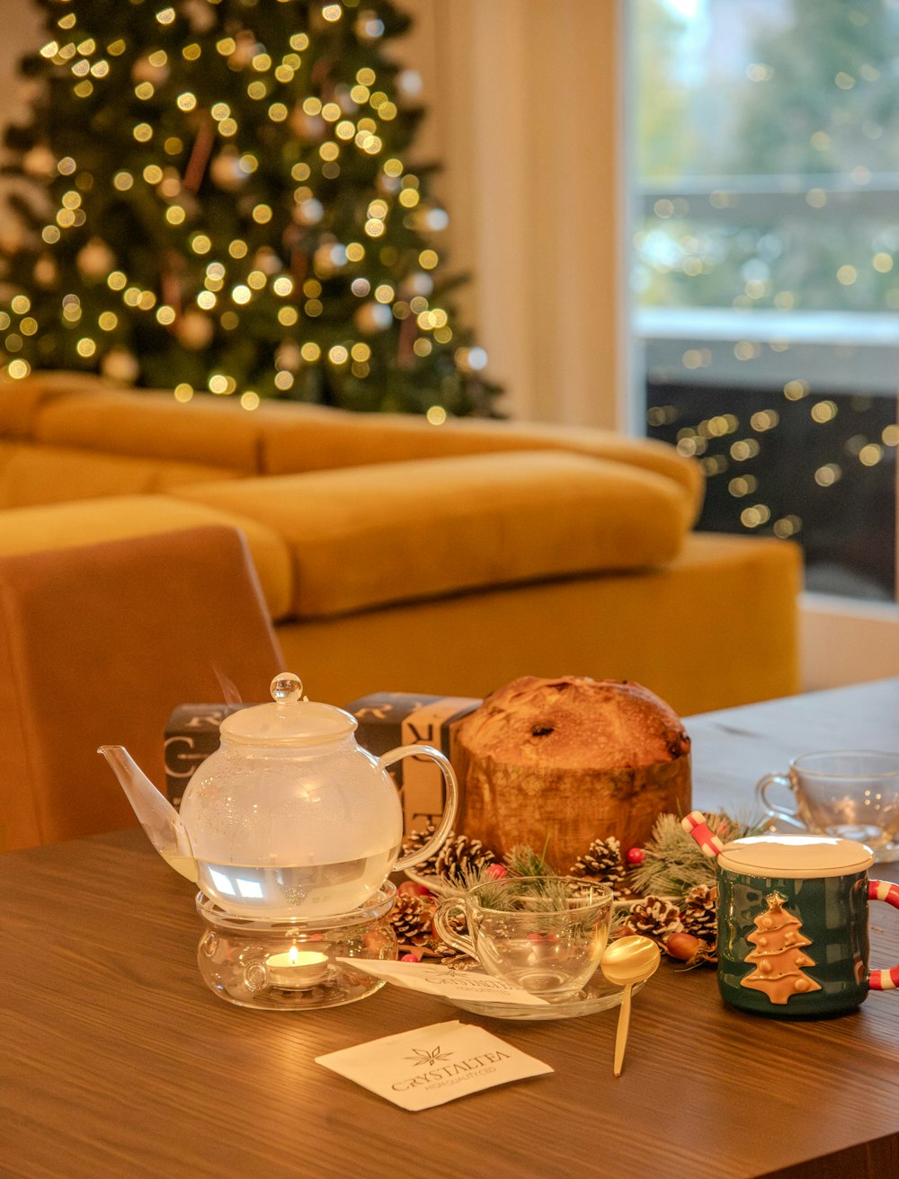 a living room filled with furniture and a christmas tree