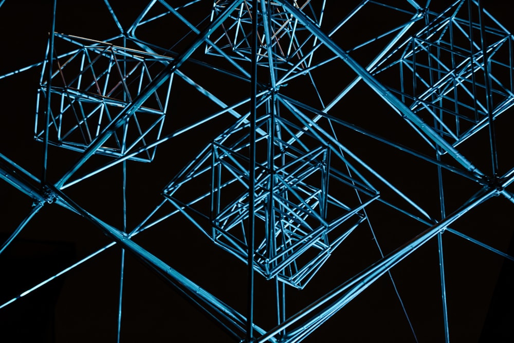 a close up of a metal structure in the dark