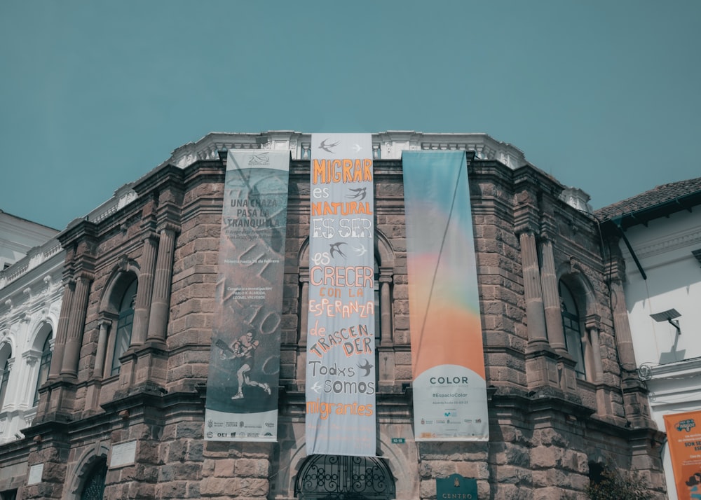 a large building with banners on the side of it