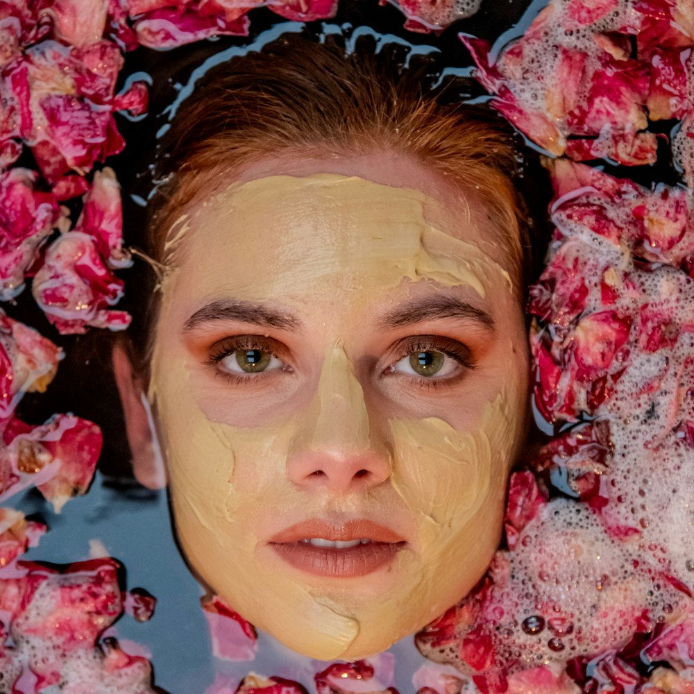 a woman with a face mask covered in soap