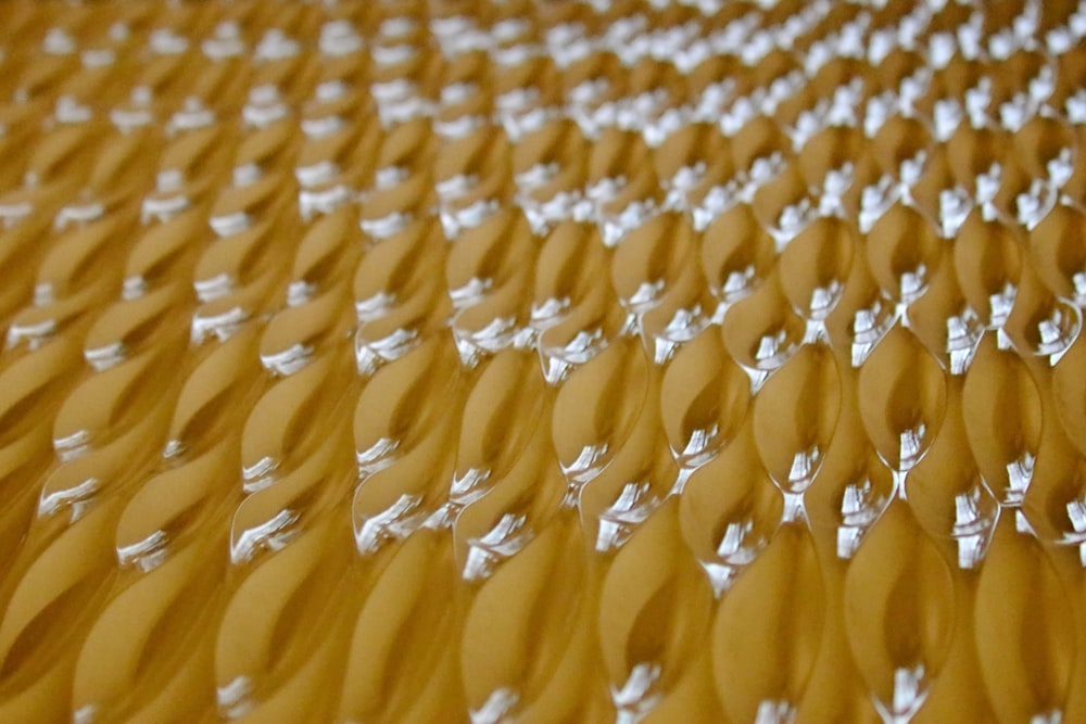 a close up of a pattern made of white pins