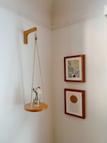 A modern interior corner with a vibrant wall art piece and carefully placed decorative vases.