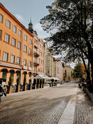 A historic city street lined with charming old buildings.