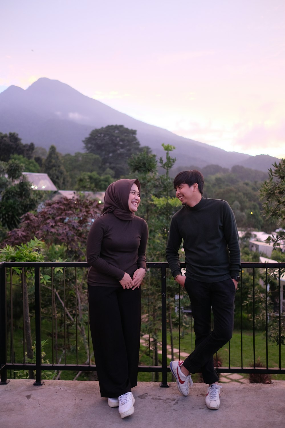 a man and a woman standing next to each other