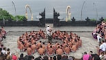 a large group of people standing around each other