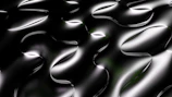 Abstract metallic textures blending black and silver tones with sharp edges.