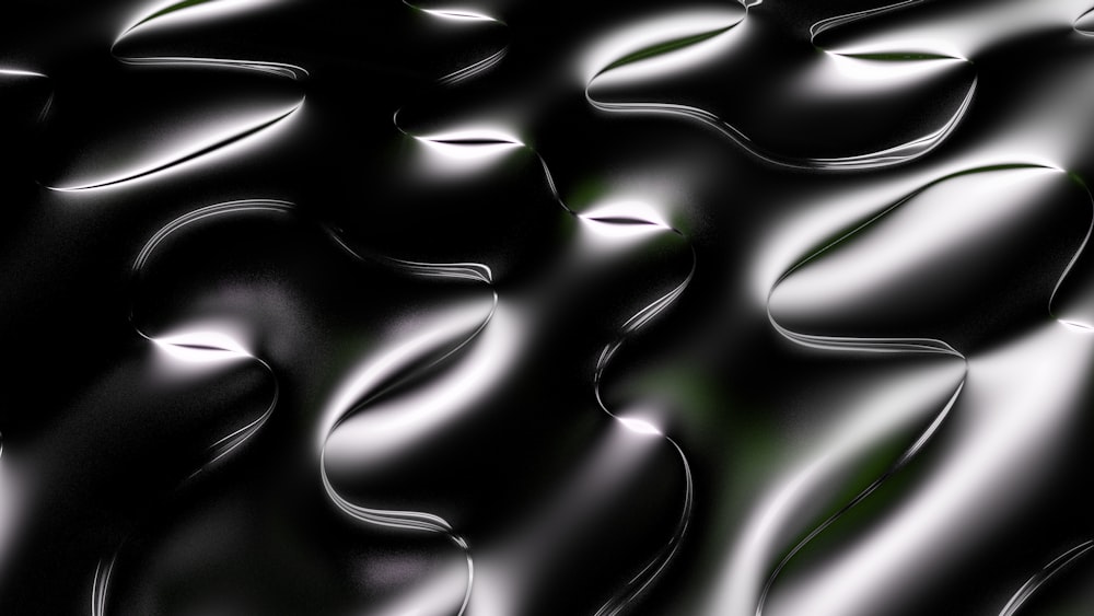 a black and white photo of a wavy surface