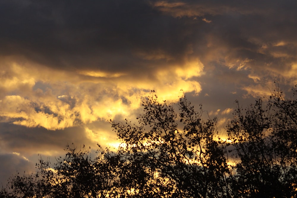 the sun is shining through the clouds in the sky