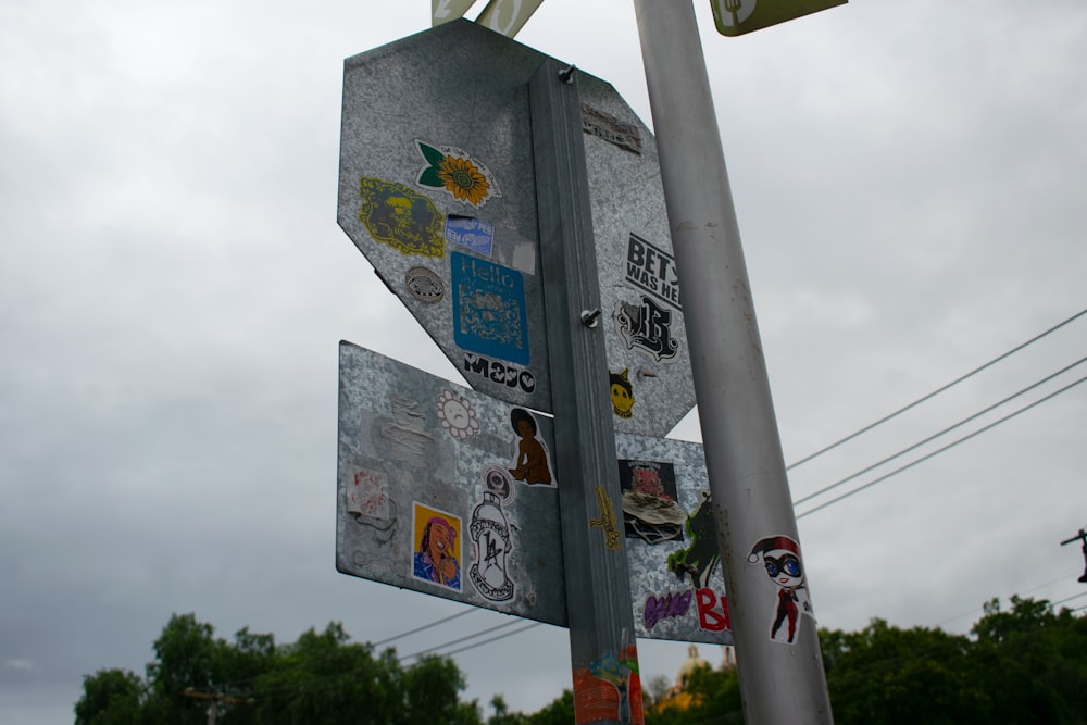 a pole with a bunch of stickers on it