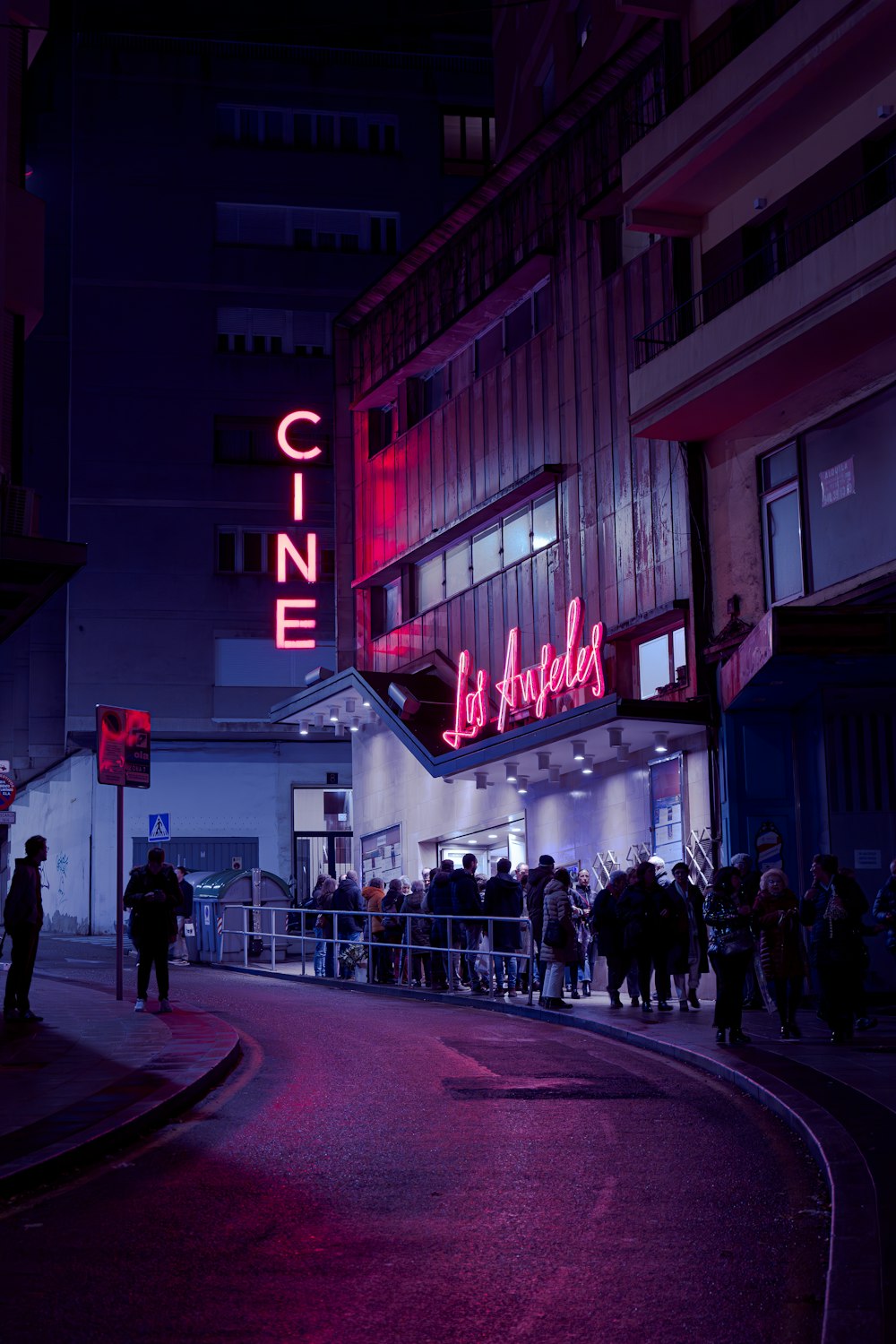 a group of people standing outside of a building