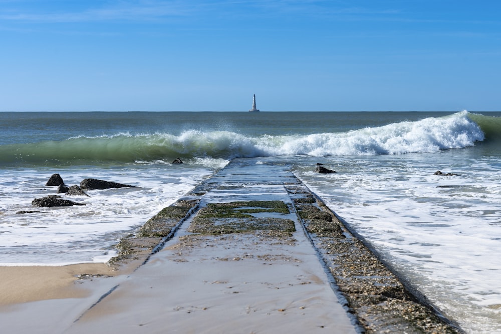 a view of the ocean from a long pier