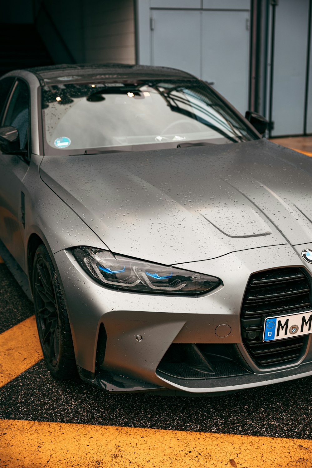 a silver sports car parked in a parking lot