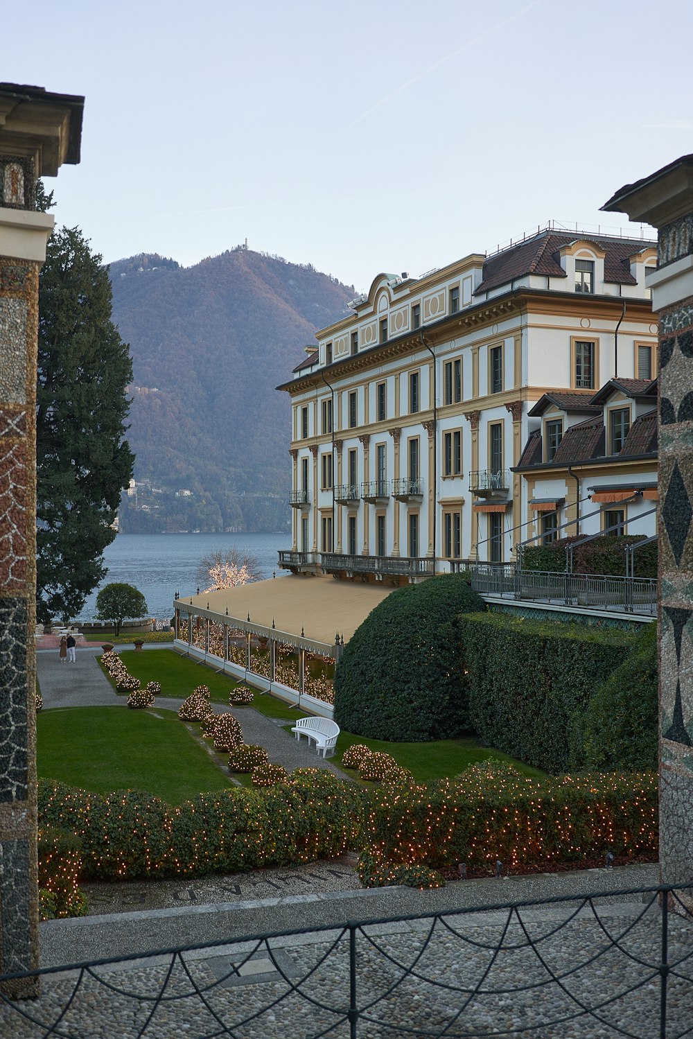 a view of a large building with a lake in the background