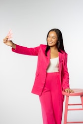 Smiling woman feeling relieved and confident after completing a financial workshop.